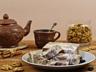 Marble halva, chocolate  isolated on a brown background.