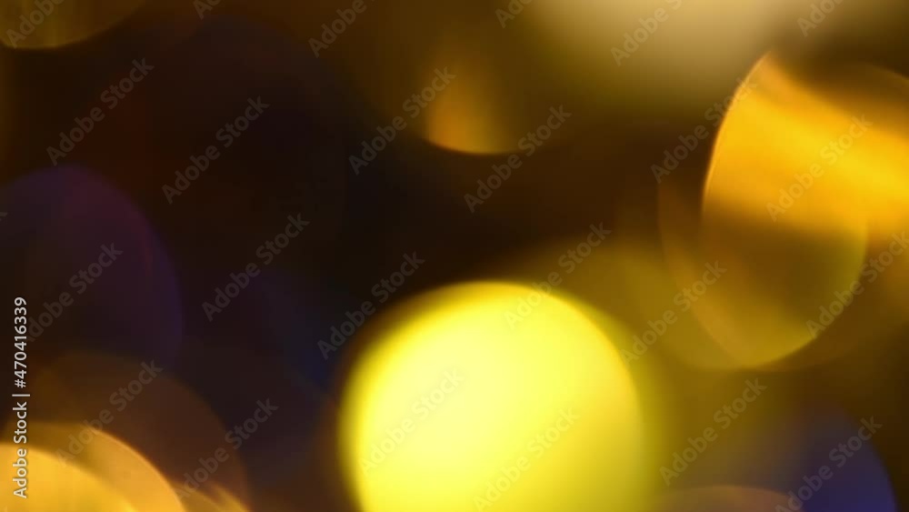 Canvas Prints bright golden bokeh abstract motion. beautiful round bokeh of gold and blue colors movement on a bla