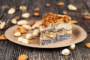 sweet cake with buttercream and sponge cake and lots of poppy seeds and nuts