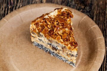 sweet cake with buttercream and sponge cake and lots of poppy seeds and nuts