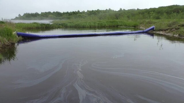 Oil pollution in the water.