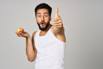 Cheerful man fruit food diet strength studio lifestyle