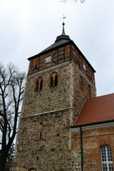 Fototapeta na wymiar old stone catholic church in autumn day