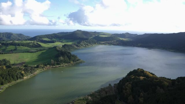 Panning right on the crater lake Furnas on viewpoint Miradouro do Pico do Ferro