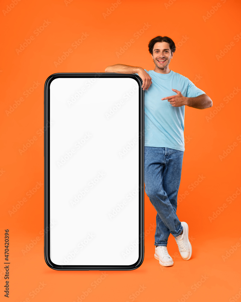 Poster guy pointing and leaning on big white empty smartphone screen
