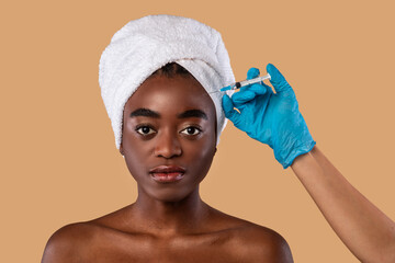 Black Lady Receiving Facial Skin Lifting Treatment