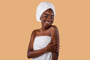 Portrait of beautiful young black woman smiling at studio