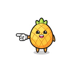 pineapple cartoon with pointing left gesture