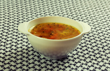 Bowl of delicious soup in a white plate
