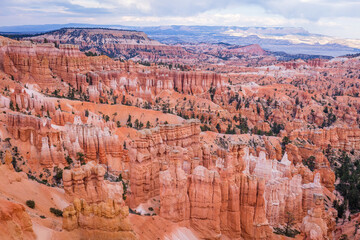 Fototapeta na wymiar Spectacular view at the cliffs and cloud sky. Amazing mountain landscape. Breathtaking view of the canyon. Bryce Canyon National Park. Utah. USA