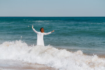 Fototapeta na wymiar Woman in white dress near the ocean walk fresh air landscape