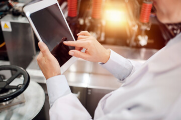 Using tablet at polymer factory storage