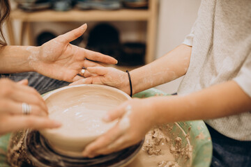 Mother with son at a pottery class