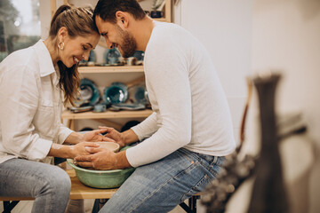 Young couple at a pottery class together