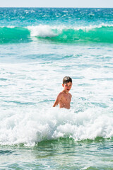 Boy playing in sea, close up, Alvor, Algarve, Portugal, Europe