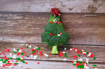 Christmas tree made from broccoli, on a wooden background, close-up, selective focus.2022,2023