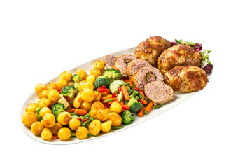 Banquet food dish. Meatloaf with potatoes, vegetables and salad in a plate isolated on white background