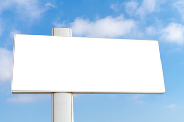 Mock up of big horizontal blank white billboard on blue sky with white clouds background