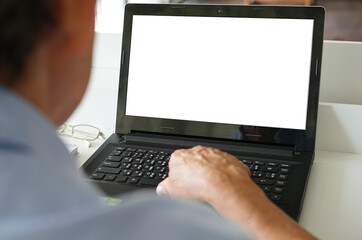 an old man using laptop with white blank screen(selective focus) at home, concept leisure activities in elderly people,lifestyle