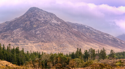 Beautiful landscape scenery of Owenmore river with mountains in the background at Connemara National park in county Galway, Ireland 