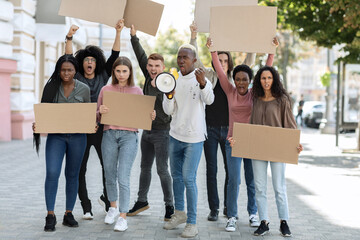 Motivated african american man with loudspeaker over crowd