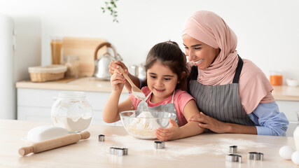 Baking At Home. Muslim Woman And Little Daughter Making Dough For Cookies