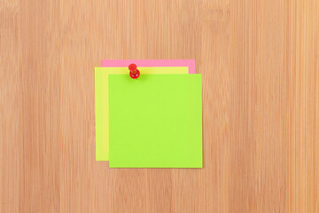 Colored Sticky Notes with Copyspace Pinned to the Wooden Message Board. To Do List Reminder in...