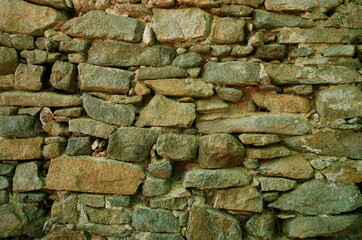 Old ancient Grunge wall stone background textures, rock background. Real stone wall surface, ancient vintage texture background.