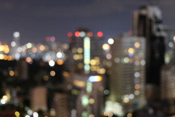 Plakat Abstract blurred lights city office building downtown background, beautiful cityscape view in night time.