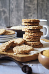 Crispy oatmeal cookies with unrefined brown sugar and cup of coffee
