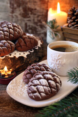 Christmas chocolate pine cone shortbread cookie and cup of coffee, New Year's decoration