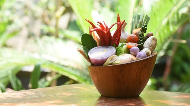 Tom Yum or vegetable and herbs on nature background.