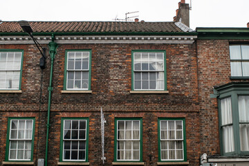 Facade of traditional British old brick townhouses in York England