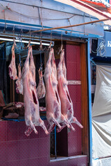 Ram carcass hanging on a hook and is being prepared for sale. Srinagar, Jammu and Kashmir state, India.