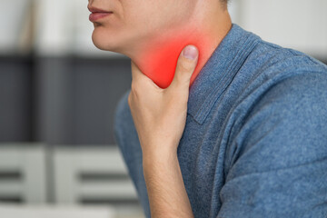 Sore throat and cough, man with pain in neck at home - obrazy, fototapety, plakaty