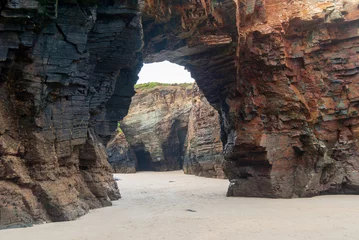 Foto auf Leinwand Rock tunnel on the beach of the cathedrals of Galicia © Jhony