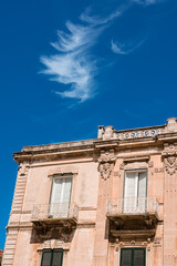 vDetails of the balconies of a building in Monopoli in Puglia (Italy)