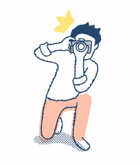 膝をついて写真撮影をしている男性