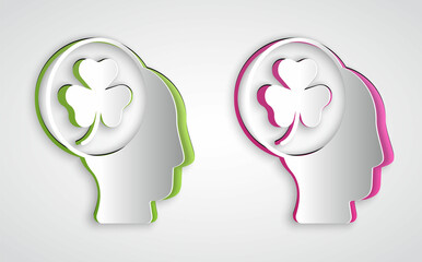 Paper cut Human head with clover trefoil leaf icon isolated on grey background. Happy Saint Patricks day. National Irish holiday. Paper art style. Vector