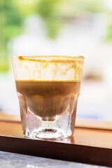 Specialty coffee menu; Dirty coffee is ristretto pouring from coffee machine into cold milk.