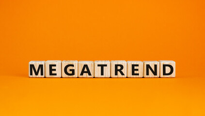 Megatrend symbol. The concept word Megatrend on wooden cubes. Beautiful orange table, orange background. Business and megatrend concept. Copy space.