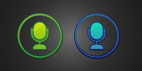 Green and blue Microphone icon isolated on black background. On air radio mic microphone. Speaker sign. Vector
