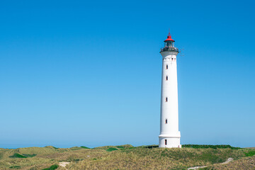 Fototapeta na wymiar Lighthouse at the danish coast called Lyngvig Fyr. High quality photo