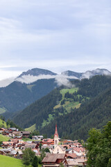 Fototapeta na wymiar Beautiful view of small alpine town Longiaru (Campill) Val Pusteria, Alto Adige, Italy