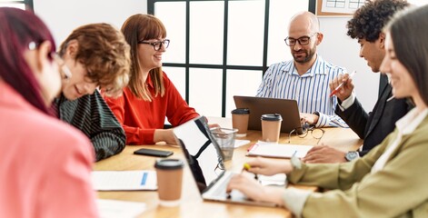Group of business workers smiling happy working at the office.