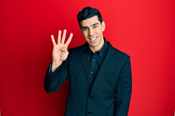 Handsome hispanic man wearing business clothes showing and pointing up with fingers number four while smiling confident and happy.