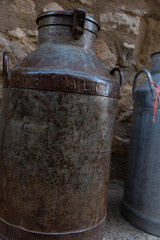 antique milk churns different sizes and colors