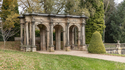 Fototapeta na wymiar Arches made of sandstone in a garden