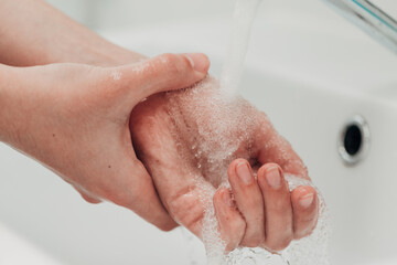 The Girl Washes Her Hands to Avoid Infection With the Virus COVID-19