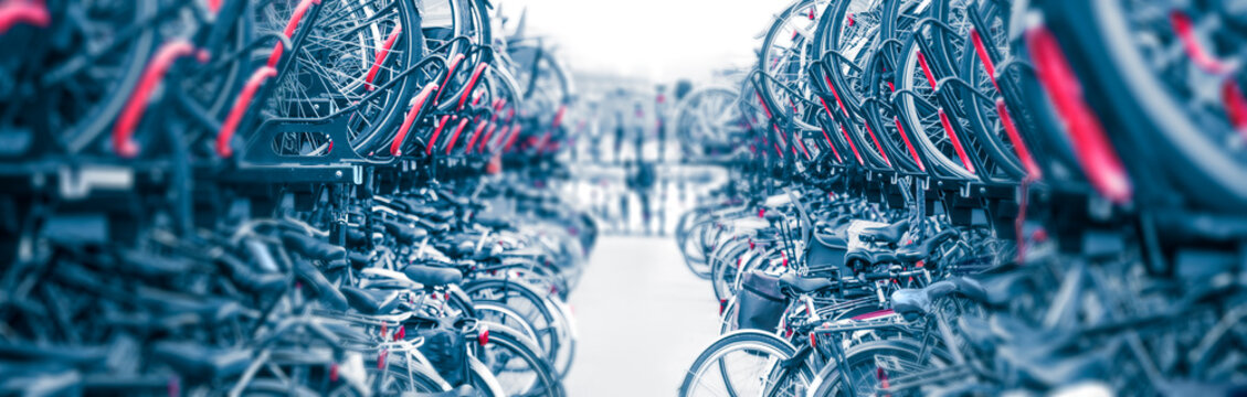 Bicycles Background - Public city bike parking. Eco-friendly transport for a healthy life. Bicycle parking